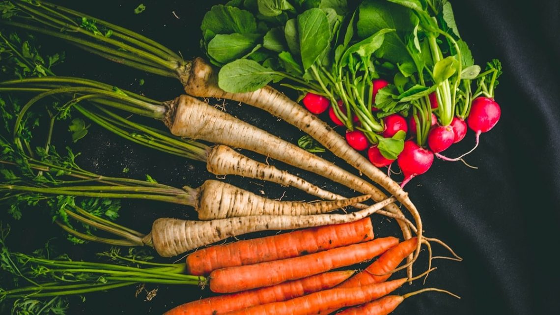Food photography if vegetables on black background