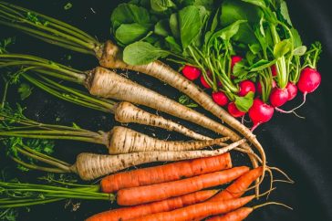 Food photography if vegetables on black background